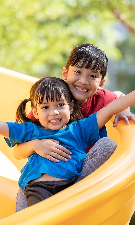 Two children on slide